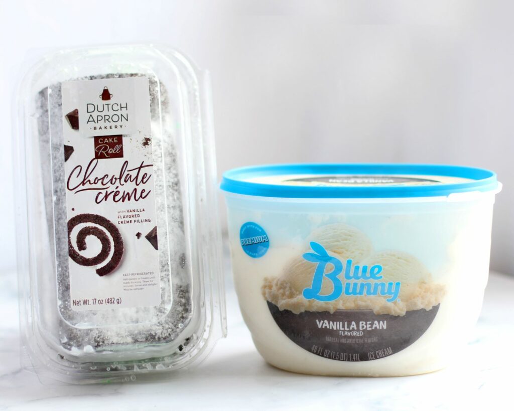 Dutch Apron Bakery Chocolate Creme Cake Roll in clamshell and Blue Bunny Vanilla Bean Ice Cream container