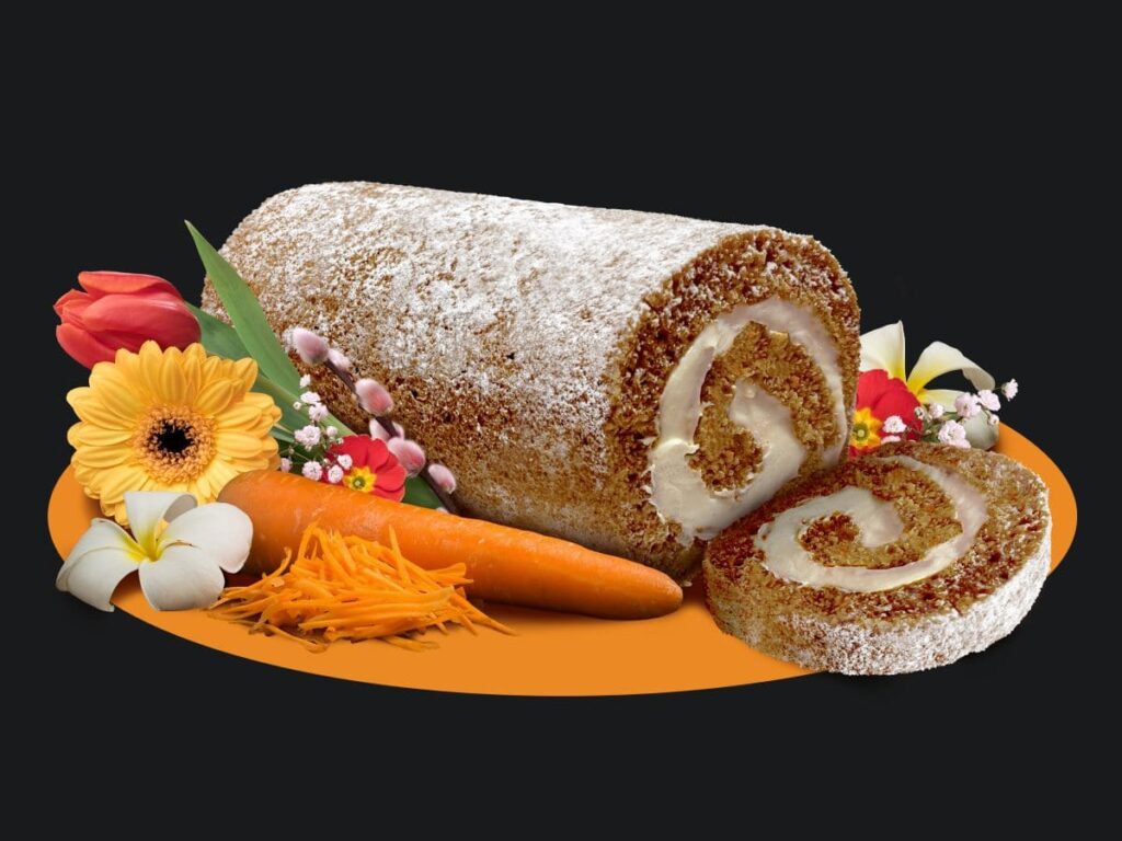Carrot Cake Cake Roll with carrot, shredded carrot, and flowers