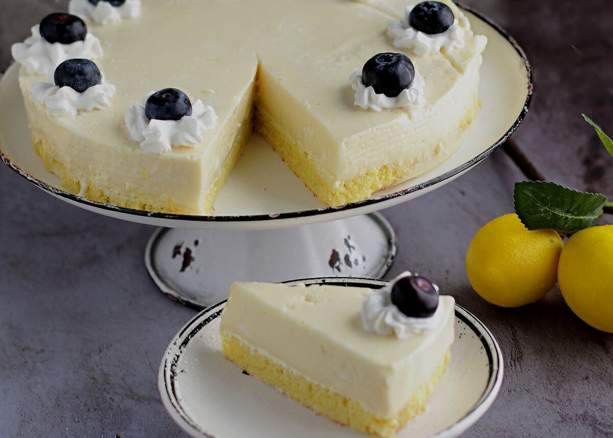 No-Bake Lemon Cheesecake with blueberries and whipped cream decorations