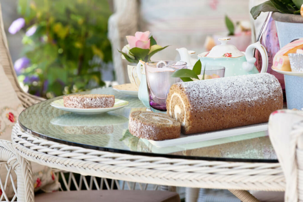 Tips for Throwing a Garden Party - carrot cake roll on decorated outside table