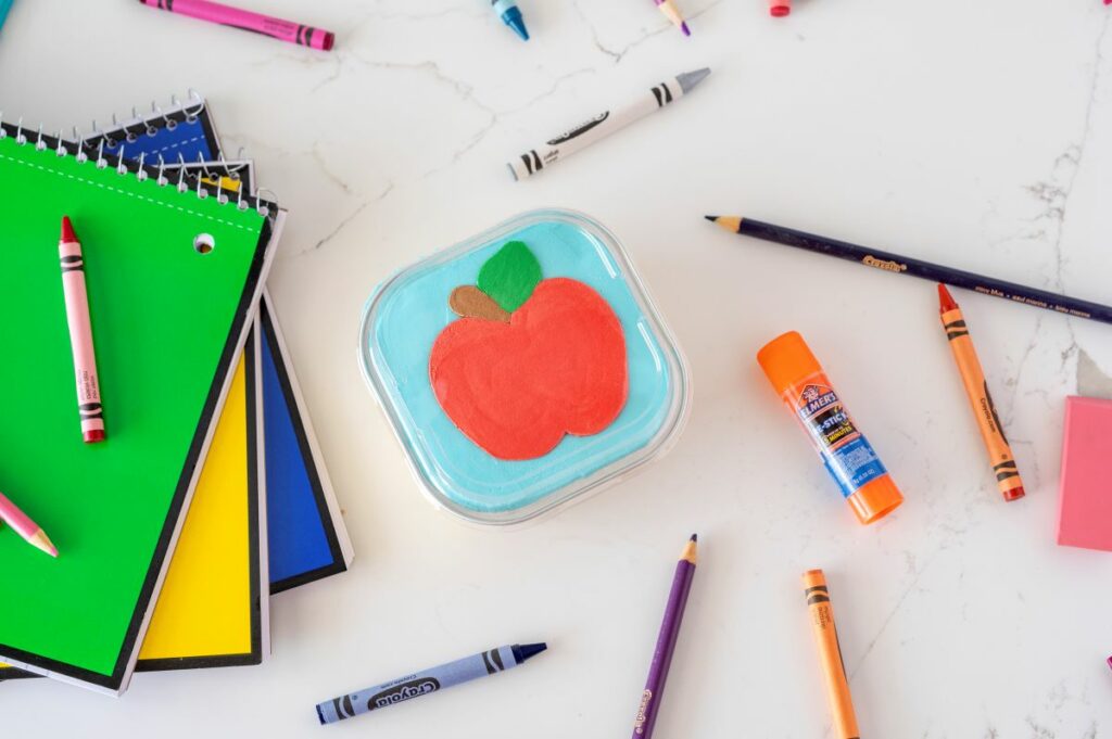Chocolate Chip Cookie Snack pan - decorated with an icing apple - surrounded by school supplies